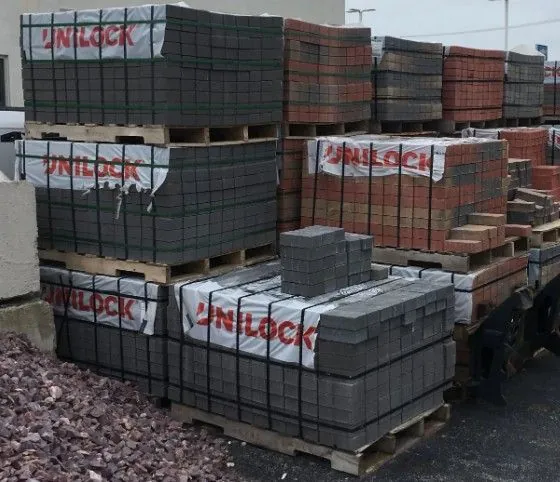 Unilock-wrapped paver and wall brick pallets stocked in the Krooswyk yard