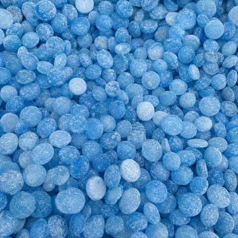 Close-up of blue ice melt pellets (generic photo, not product packaging)