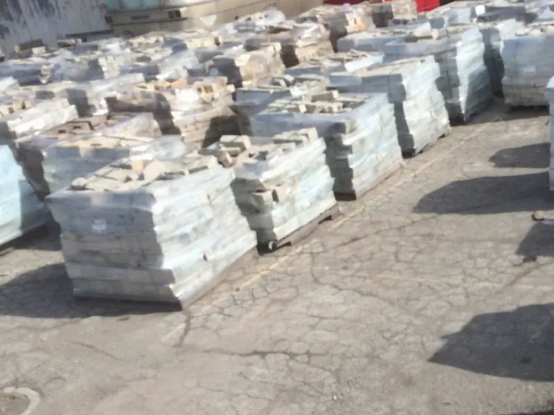 Shrink-wrapped pallets of natural stone in the Krooswyk yard